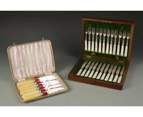 A SET OF EDWARDIAN MOTHER OF PEARL MOUNTED SILVER FRUIT EATERS, in a fitted case with chased handles, by William Hutton and S