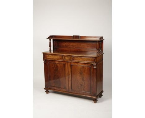 A REGENCY MAHOGANY SIDEBOARD, the rectangular top with a raised shelf on tapering octagonal columns, with a single panel fron