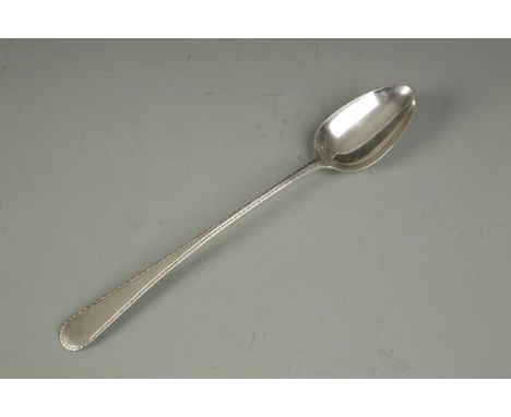 A GEORGE III BASTING SPOON, of feather edged pattern, by Hester Bateman, London 1774, 11.25" long, (c.3oz).