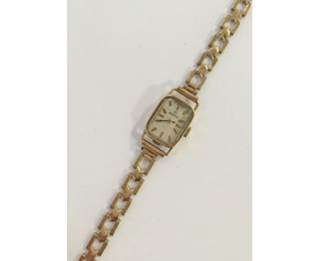 ZENITH: A LADY'S 9CT YELLOW GOLD WRISTWATCH, the rectangular dial with raised gilt baton numerals, inscribed 'Zenith', attach