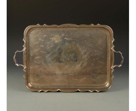 A PRESENTATION TRAY of shaped rectangular form with reeded carrying handles, the body monogrammed and engraved with facsimile