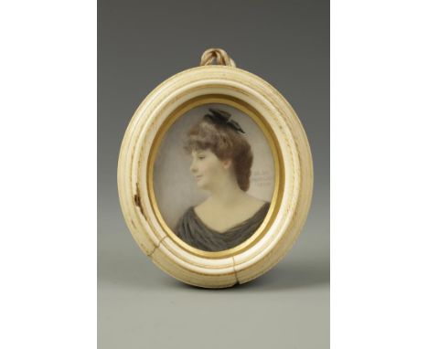 OLGA MORGAN A portrait miniature on ivory of a side profile of a lady, probably Vera Morgan, wearing a black gown and black r