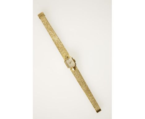 INTERNATIONAL WATCH COMPANY: A LADY'S 9CT YELLOW GOLD WRISTWATCH, the rectangular dial with dot and baton numerals, inscribed