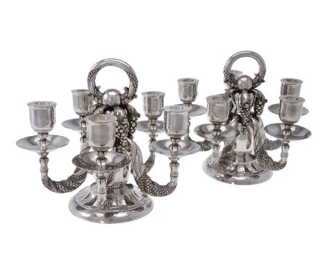 Georg Jensen, a pair of Danish silver Grape pattern candelabra, post 1945 stamped marks, design no. 383A, designed by Georg J