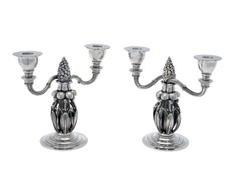 Georg Jensen, a pair of Danish silver Fir Cone twin light candelabra, post 1945 stamped marks, design no. 244, 21cm (8 1/4in)