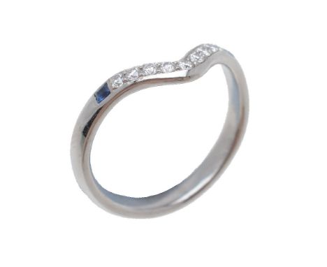 A diamond and sapphire wishbone ring, set with brilliant cut diamonds, approximately 0.12 carats total, between two square cu