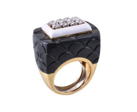 A ceramic and diamond dress ring by Veschetti, the black ceramic panel with scaled detail, with a central rectangular white e