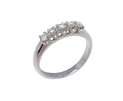 A five stone diamond ring, the brilliant cut diamonds in four claw settings, approximately 0.25 carats total, stamped 750, fi