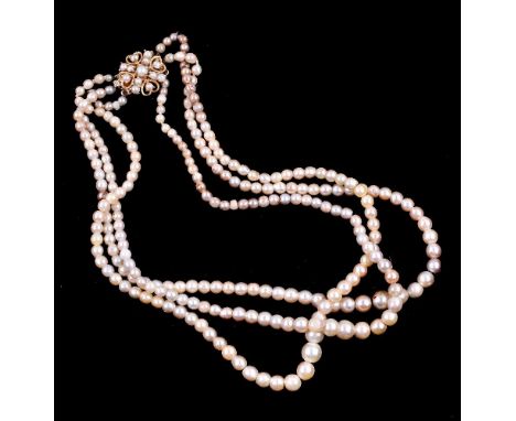 A cultured pearl necklace, the three graduated rows of cultured pearls to a pierced 9 carat gold clasp, with half cultured pe