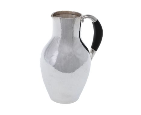 ϒGeorg Jensen, a Danish silver water jug or pitcher, post 1945 stamped marks, design no. 743, designed by Johan Rohde, with a