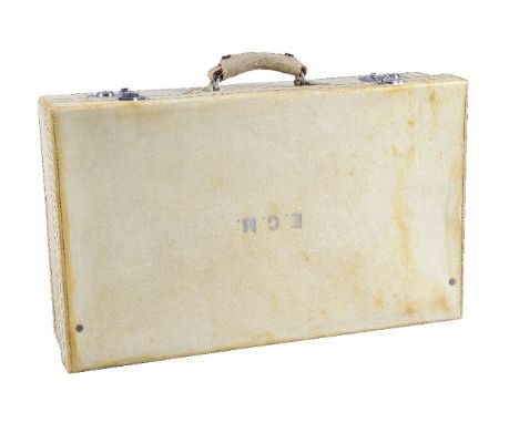 Finnigans, a leather travelling suitcase, with a loop handle, white metal locks and monogrammed E.G.M, opening to a red leath