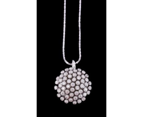 A diamond cluster pendant, the circular panel with brilliant cut diamonds in raised cone settings within textured surrounds, 