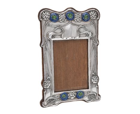 An Art Nouveau silver photograph frame by Horton &amp; Allday, Birmingham 1902, shaped rectangular, embossed with stylised ro