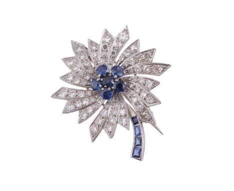 A sapphire and diamond cornflower brooch, the geometric petals set with eight cut diamonds, approximately 0.78 carats total, 