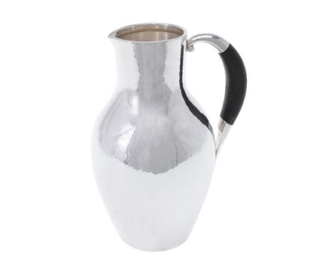 ϒGeorg Jensen, a Danish silver water jug or pitcher, post 1945 stamped marks, design no. 743, designed by Johan Rohde, with a