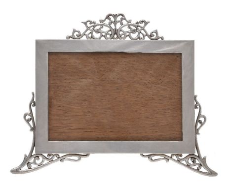 An Edwardian silver photograph frame by Mappin and Webb, London 1904, plain rectangular with a scroll pierced surmount and co