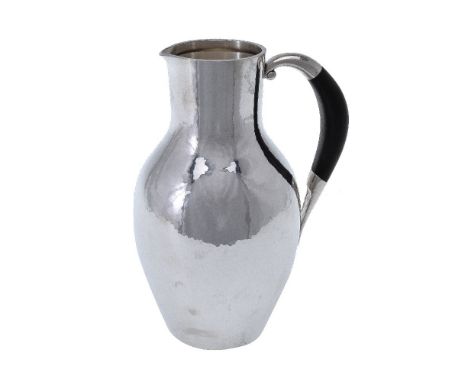 ϒGeorg Jensen, a Danish silver water jug or pitcher, post 1945 stamped marks, design no. 743, designed by Johan Rohde, with a