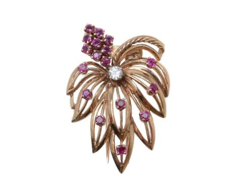 A 9 carat gold 1960s ruby and diamond brooch, of foliate design, set with circular cut rubies and a brilliant cut diamond, es