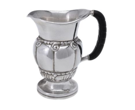 ϒ Georg Jensen, a Danish silver water jug or pitcher, post 1945 stamped marks, design no. 7, with an ebony handle, 20cm (8in)