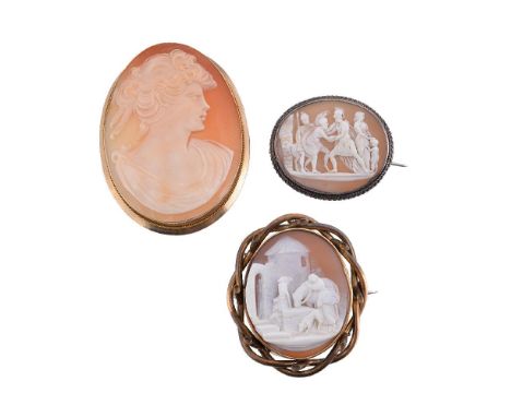 Three shell cameo brooches, the first with the profile of a lady, within a polished setting, stamped 375, 6.1cm long; togethe