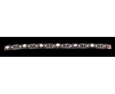 A mid 20th century pearl and diamond bracelet, the pierced scrolled marquise shaped panels each centred with a pearl with las