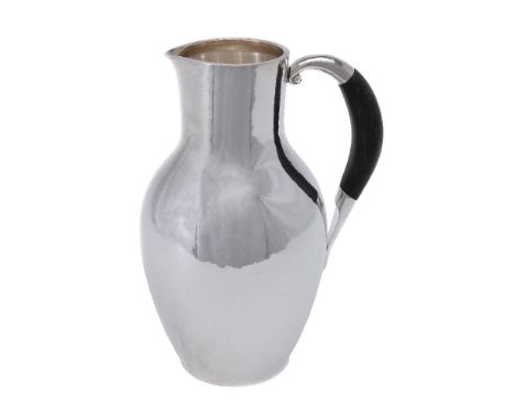 ϒGeorg Jensen, a Danish silver water jug or pitcher, post 1945 stamped marks, design no. 743, designed by Johan Rohde, with a