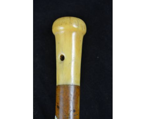 An ivory mounted malacca walking stick, the handle pierced for tassel, no collar, metal ferrule - overall length 81cm CONDITI