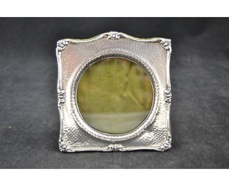 A hammered silver photo frame with scroll design, Birmingham 1903, maker H. Matthews,  - 11x11cm CONDITION REPORT: good condi