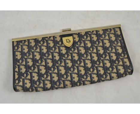 A vintage Dior monogram snap fastening clutch bag in the navy colourway, applied gilt metal shield to front bears Dior logo, 