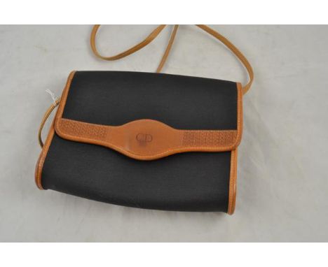 A vintage Christian Dior black fabric shoulder bag, tan leather trim and strap, edge of flap bears embossed CD logo, gilt met