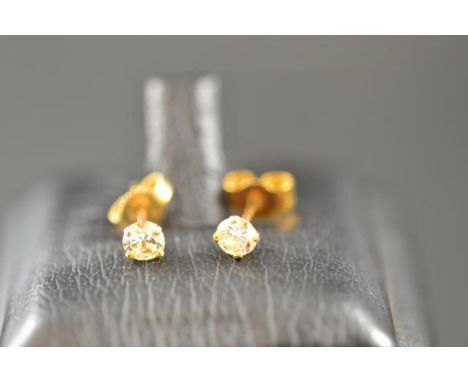 A pair of 18ct gold diamond stud earrings, each diamond  modern brilliant cut and 16 points, clarity SI colour K.