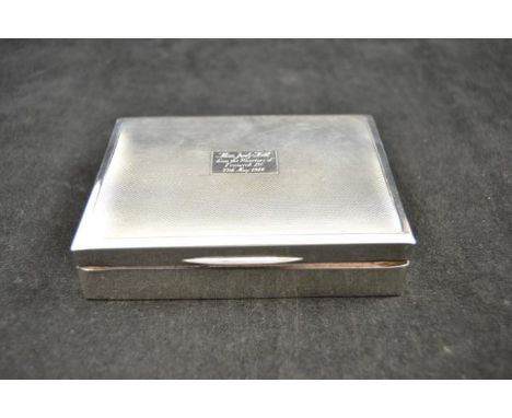 A silver engine turned cigarette box, inscribed to centre of lid, London 1965, maker Robert Pringle CONDITION REPORT: very sl