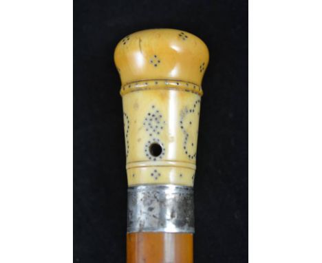 An ivory and pique work malacca walking stick, the 18th century 6.5cm handle pierced for tassel and opening to reveal a compa