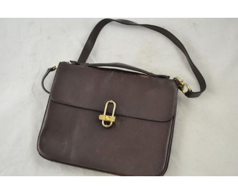 A vintage Celine handbag & shoulder strap, dark brown leather, fastened with gilt metal clasp, three compartments & zipped po