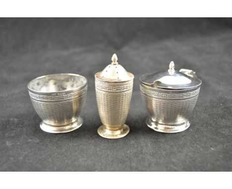 A silver three piece condiment set, engine turned decoration, Birmingham 1922 - approx weight 157g/5 troy oz CONDITION REPORT