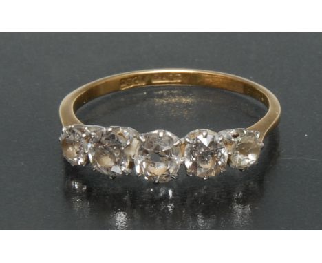 A diamond quintet ring, central oval old cut diamond approx 0.45ct, flanked by a pair of graduating diamond either side, tota