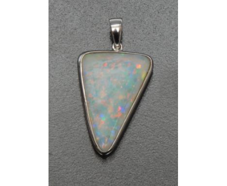 An Australian arrow head opal pendant, measuring approx 22.6mm x 14.80mm, estimated carat weight 5.69ct, flashing strong colo