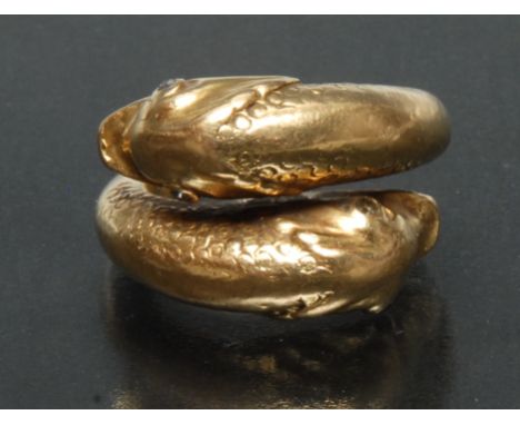 An unusual diamond accented 18ct gold signet ring,  open cast shank with a baroque Dolphin head either end, diamond accented 