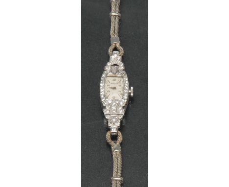 Rolex - a lady's diamond encrusted cocktail watch, rectangular dial, alternate Arabic numerals and block baton markers, singl