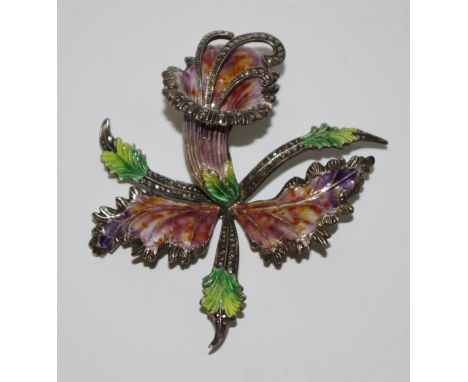 A white coloured metal enamel and marcasite foxglove brooch, in green, purple and orange,  c.1920
