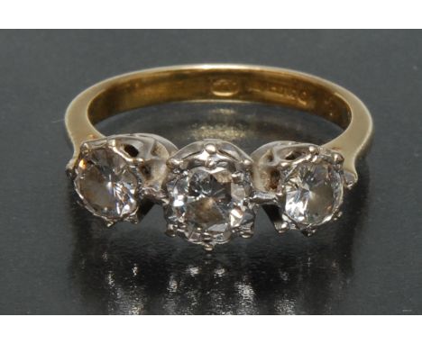 A diamond trilogy ring, central old brilliant cut diamond approx 0.45ct, flanked either side by a smaller stone each approx 0