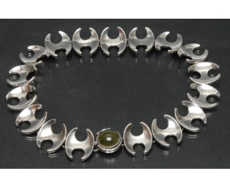 Georg Jensen (1866-1935) - a silver and jade necklace designed by Henning Koppel (1918-81), the round jade cabochon collet mo