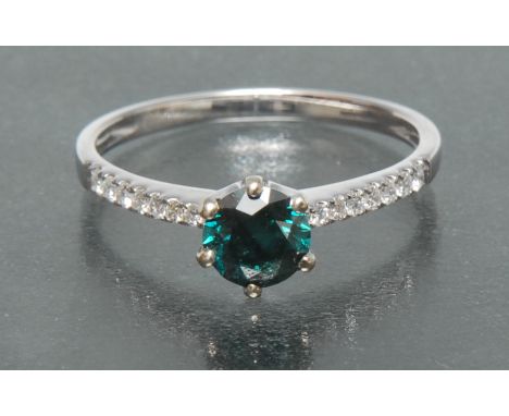 A fancy green blue and white diamond ring, central six claw set greenish blue fancy diamond approx 0.65ct, flanked either sid