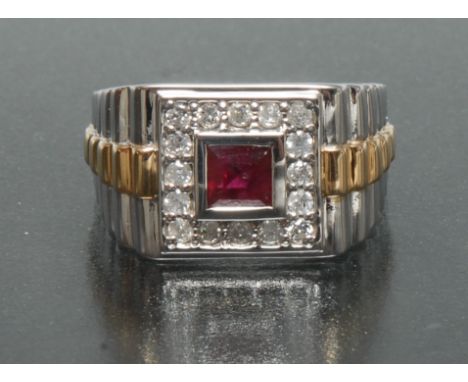 A ruby and diamond signet ring, central square cut red ruby approx 0.97ct, surrounded by a band of sixteen round brilliant cu