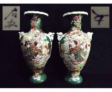 Large Mirror Pair of Japanese Stoneware Flower Vases. Sino Tibetian. Molded Chimera or Dragons holding loop handles. Pierced 