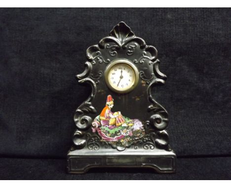 British Pottery Mantle Clock 1926. Ceramic body, Black glaze with lithograph print of a Persian seated and surrounded by Trea