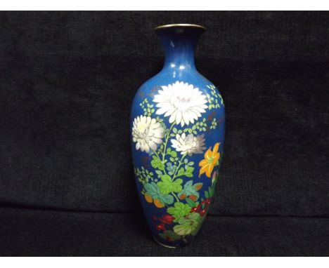 Large Japanese Cloisonne Enamel Flowers Vase. Decorated with various flowers on a blue ground. There is a repair to a part of