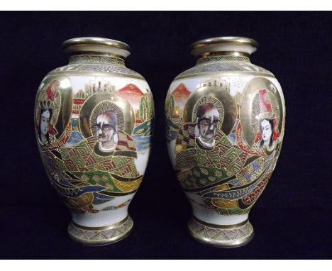 A Mirror Pair of Japanese Satsuma Vases. 20th century. Guan Yin with an Immortal. Enamel decoration. Red overglaze Character 