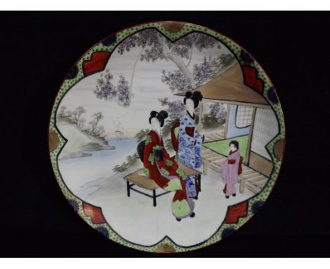 Japanese Hand Painted Porcelain Plate. Decorated with Ladies and Child in a Pagoda Seaside Scene. Painted in Colours with Gil