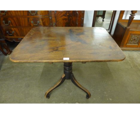 A Victorian mahogany rectangular tilt-top tripod table